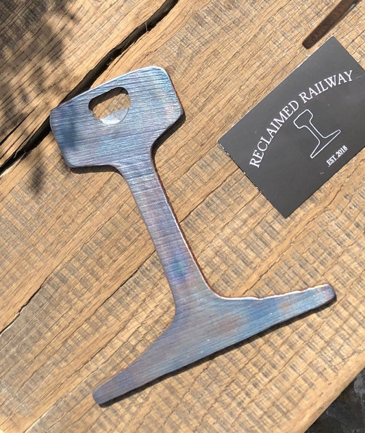 Railway track bottle opener